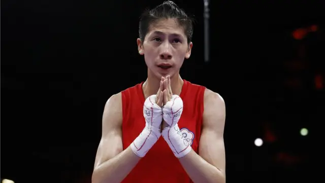 Yu Ting Lin of Taiwan celebrates after winning her fight against Sitora Turdibekova of Uzbekistan. REUTERS/Peter Cziborra